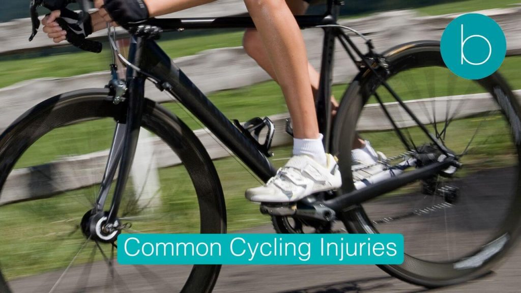 A cyclist riding through London, demonstrating proper posture to prevent common cycling injuries like back and neck pain.